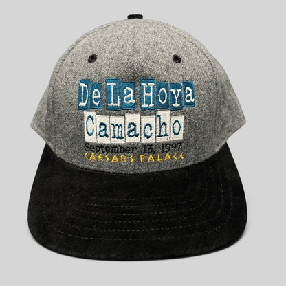 Raree Finds vintage 1997 De La Hoya vs Camacho boxing snapback hat with grey wool crown and black brim.