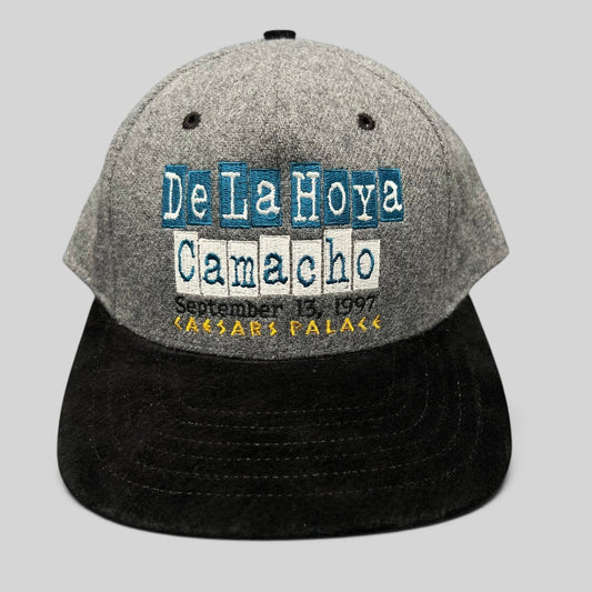 Raree Finds vintage 1997 De La Hoya vs Camacho boxing snapback hat with grey wool crown and black brim.