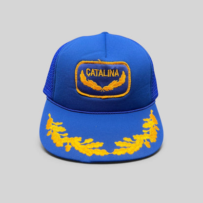 Raree Finds vintage 1980s royal blue foam trucker hat with gold Catalina patch and embroidered laurel brim detail
