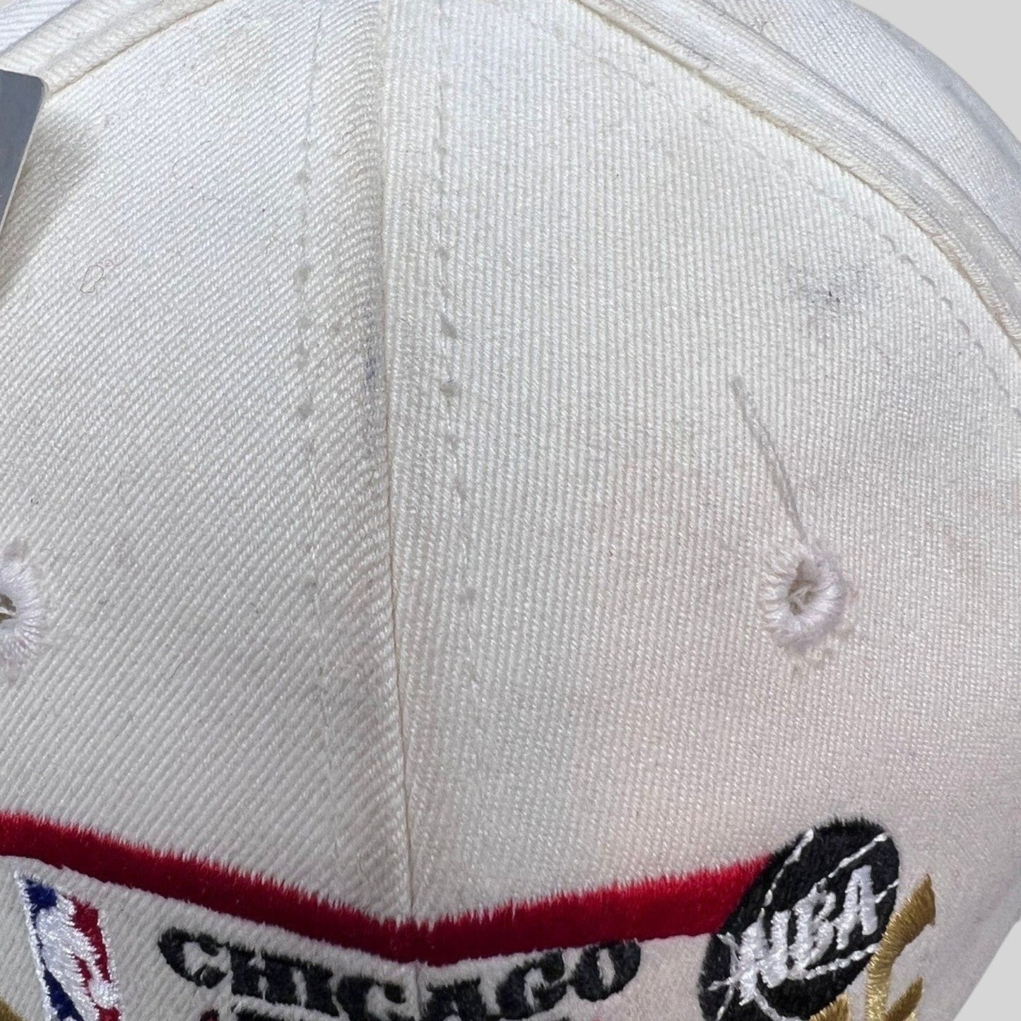Raree Finds vintage 1996 Chicago Bulls NBA Champions snapback hat in cream cotton with embroidered team logo and text.