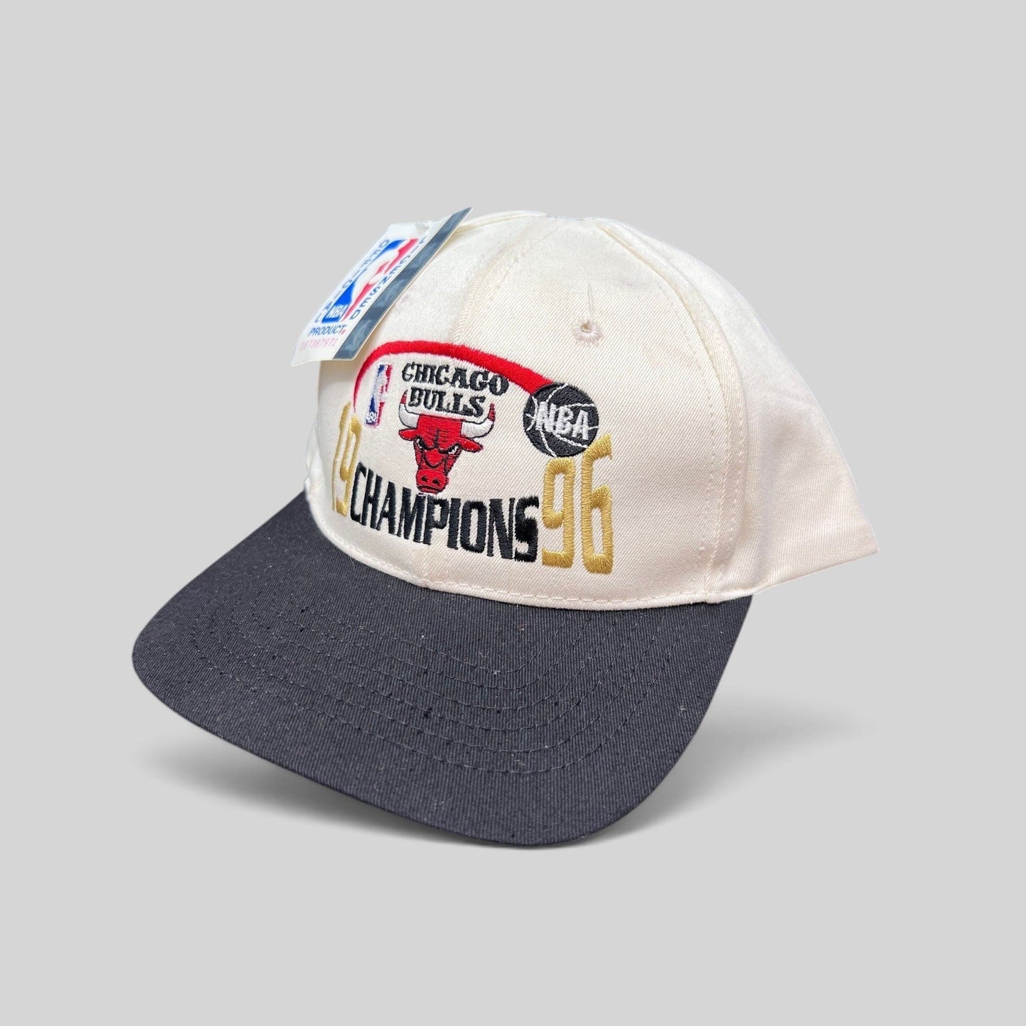 Raree Finds vintage 1996 Chicago Bulls NBA Champions snapback hat with cream crown, black brim, and embroidered logo.