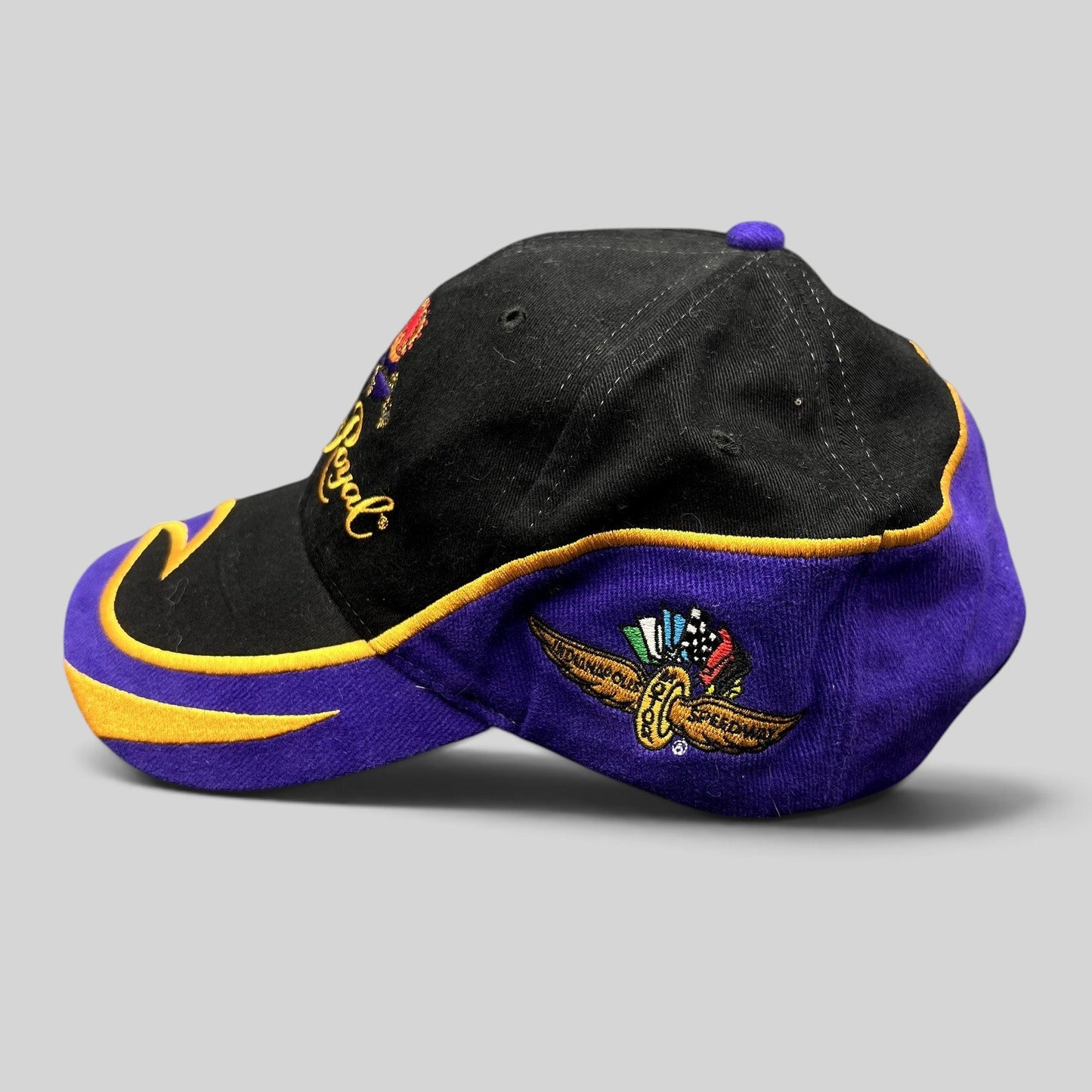 Raree Finds vintage 2003 Crown Royal Roots strapback hat in black and purple with gold embroidered racing logo details.