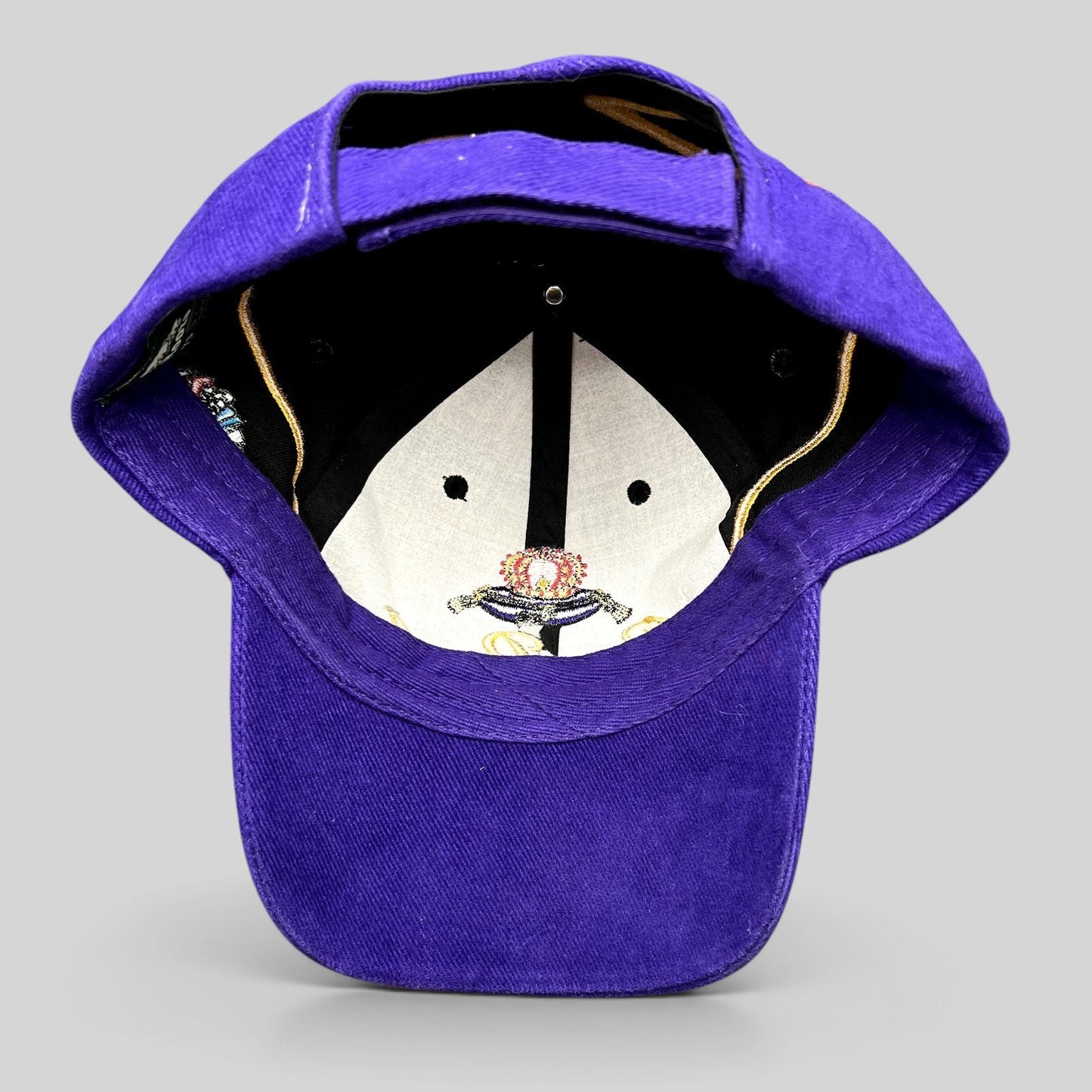 Raree Finds vintage 2003 Crown Royal Roots strapback hat in purple and black with embroidered crown logo interior view