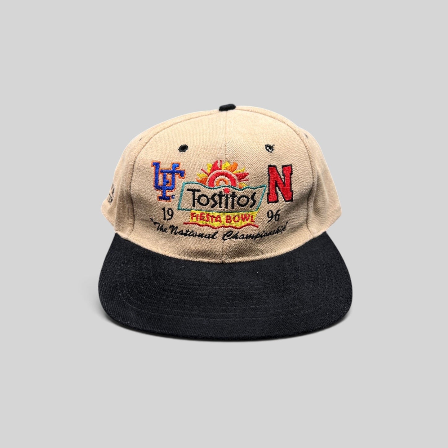 Raree Finds vintage 1996 Tostitos Fiesta Bowl snapback hat with tan crown, black brim, and multicolor team embroidery.