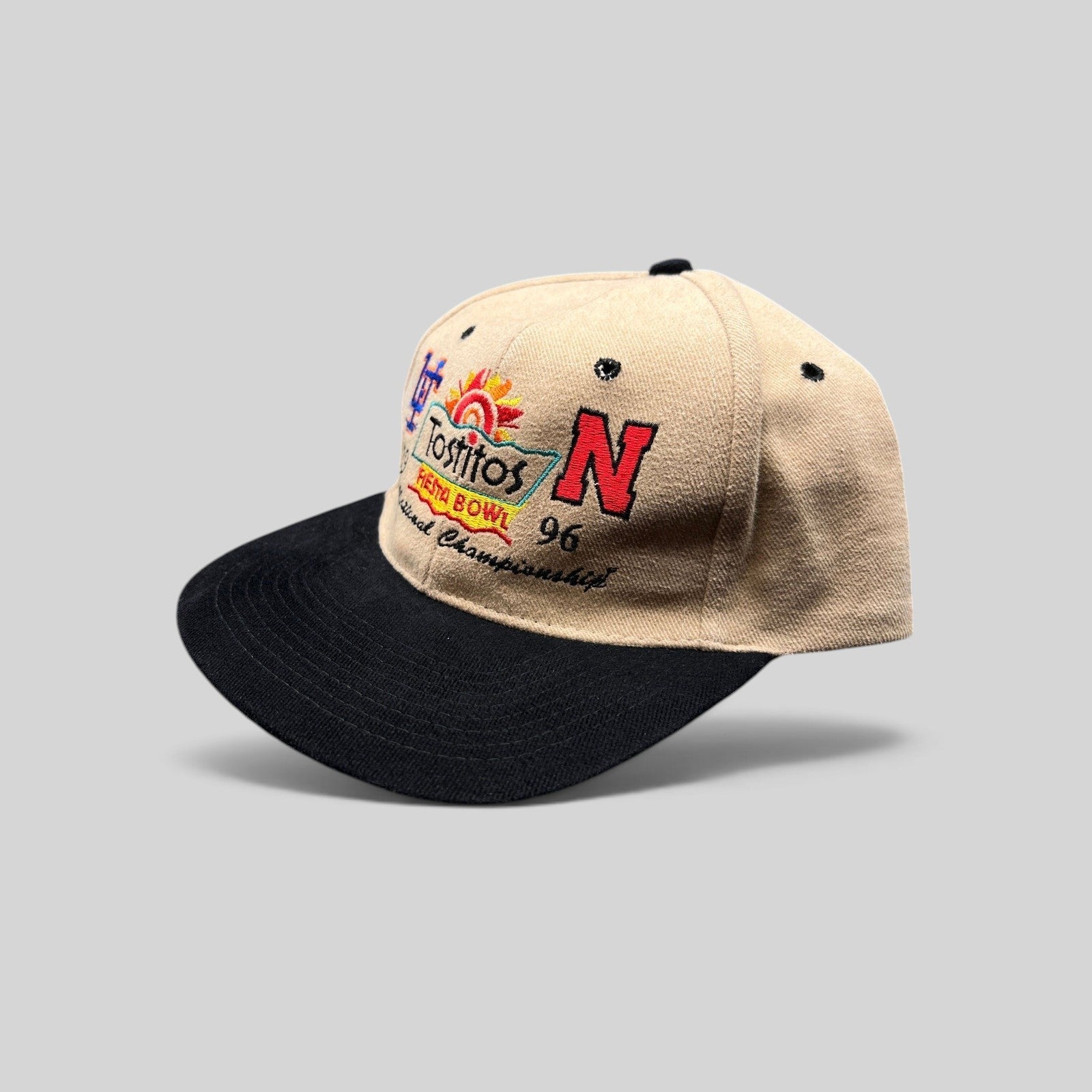 Raree Finds vintage 1996 Tostitos Fiesta Bowl snapback hat with tan cotton crown, black brim, and team embroidery.