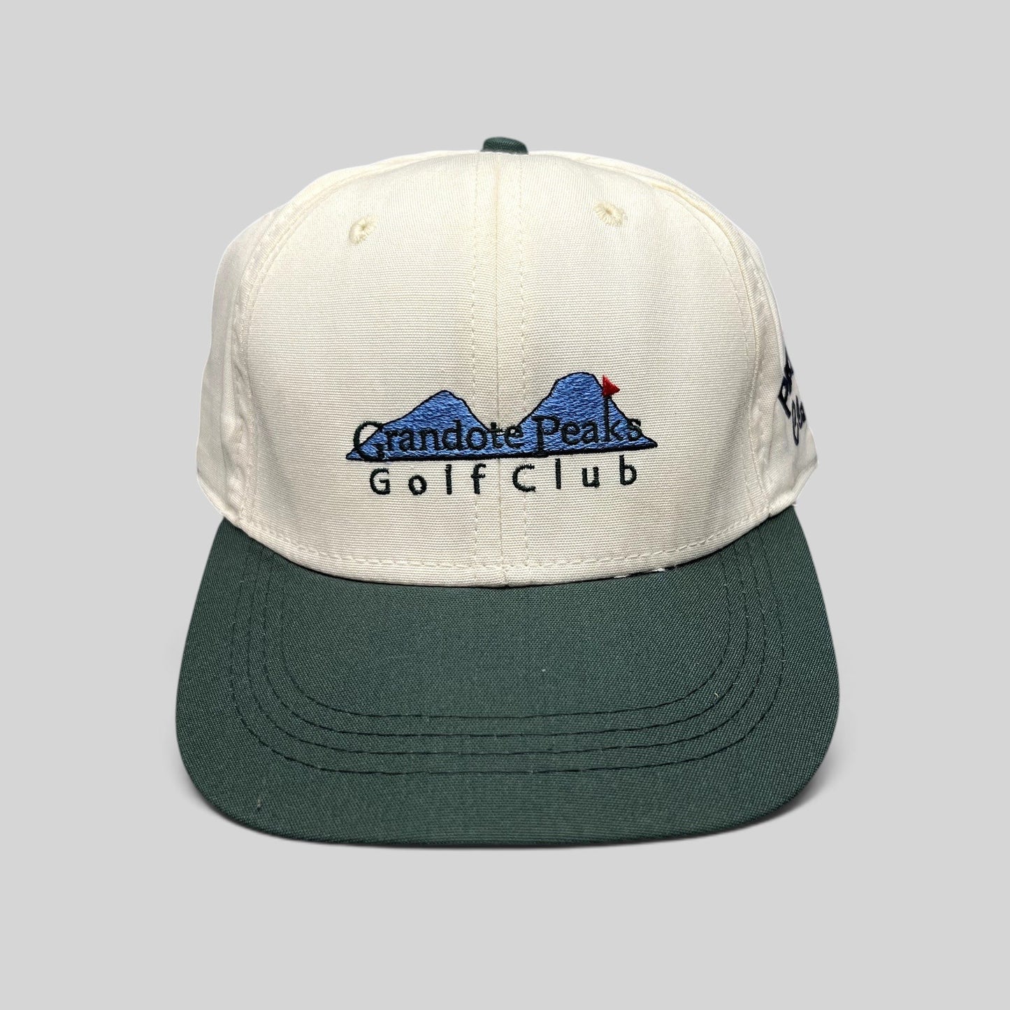 Raree Finds vintage 1997 Imperial Headwear two-tone white and green golf hat with Grandote Peaks Golf Club embroidery
