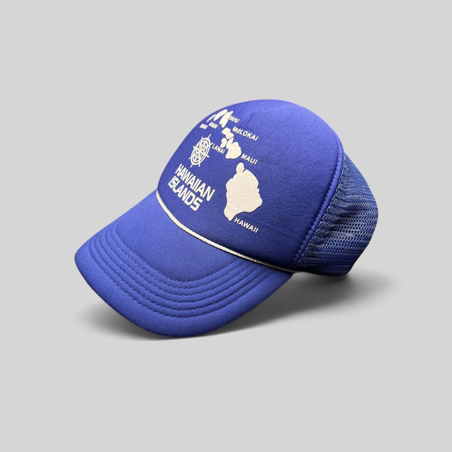 Raree Finds vintage royal blue foam trucker hat with a white Hawaiian Islands map graphic and snapback closure.