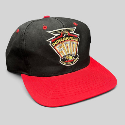 Raree Finds vintage 1997 Indianapolis 500 snapback hat with black crown, red brim, and embroidered race logo.