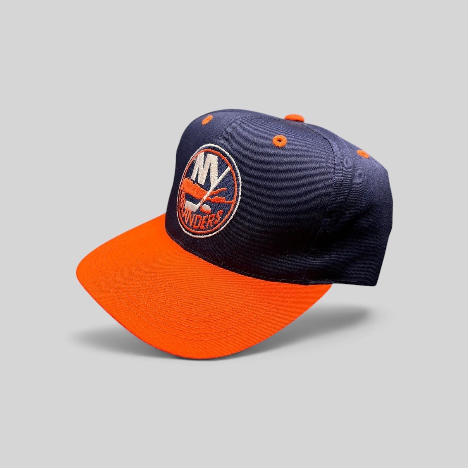 Raree Finds vintage 1990s New York Islanders snapback hat in navy and orange with embroidered team logo
