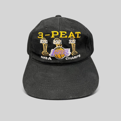 Raree Finds vintage black Los Angeles Lakers 3-Peat NBA champions cotton hat with gold, purple, and white embroidery.