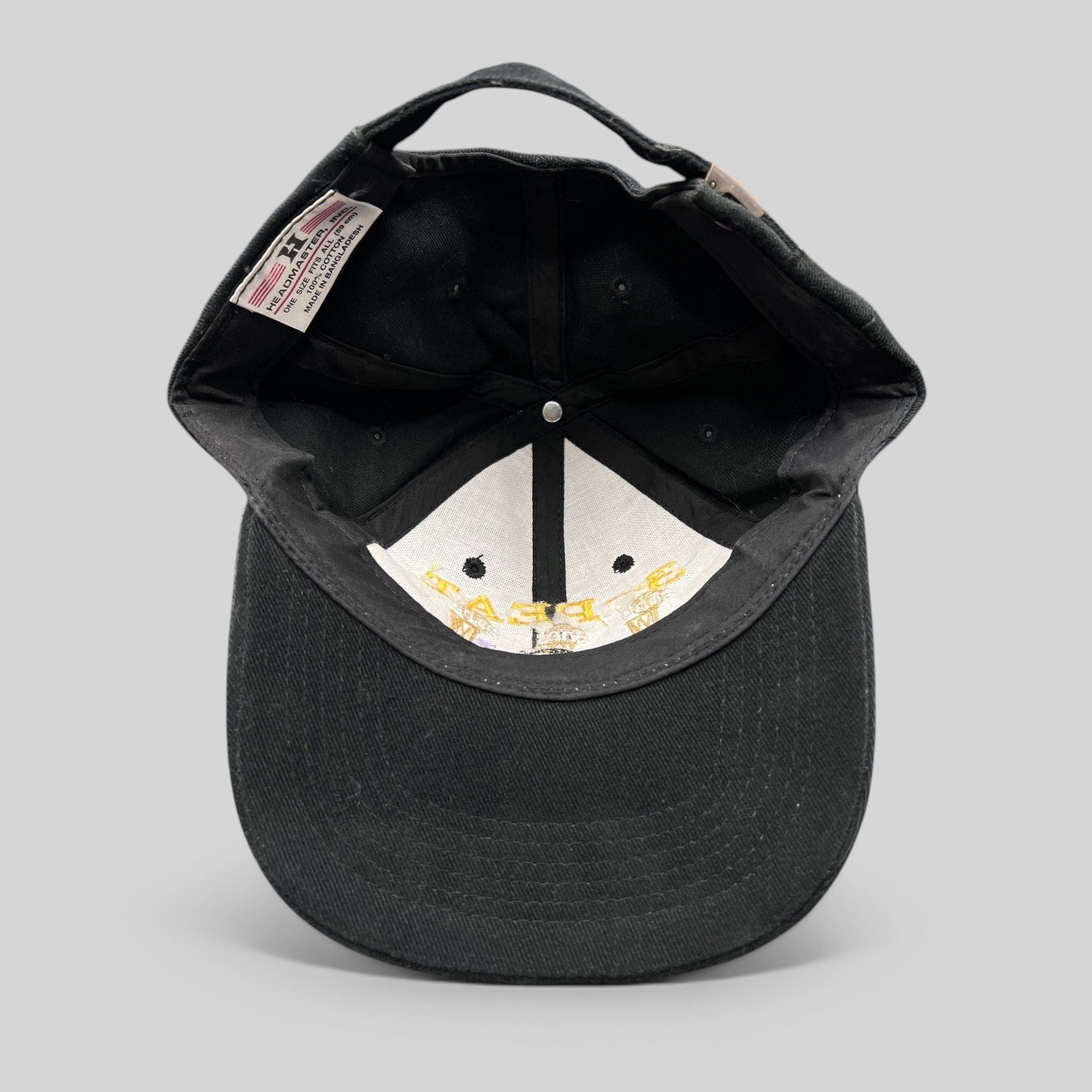 Raree Finds vintage black cotton Los Angeles Lakers 3-Peat championship hat showing interior label and construction