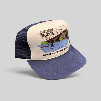 Raree Finds vintage 80s navy and white foam trucker hat featuring a London Bridge Lake Havasu City graphic print