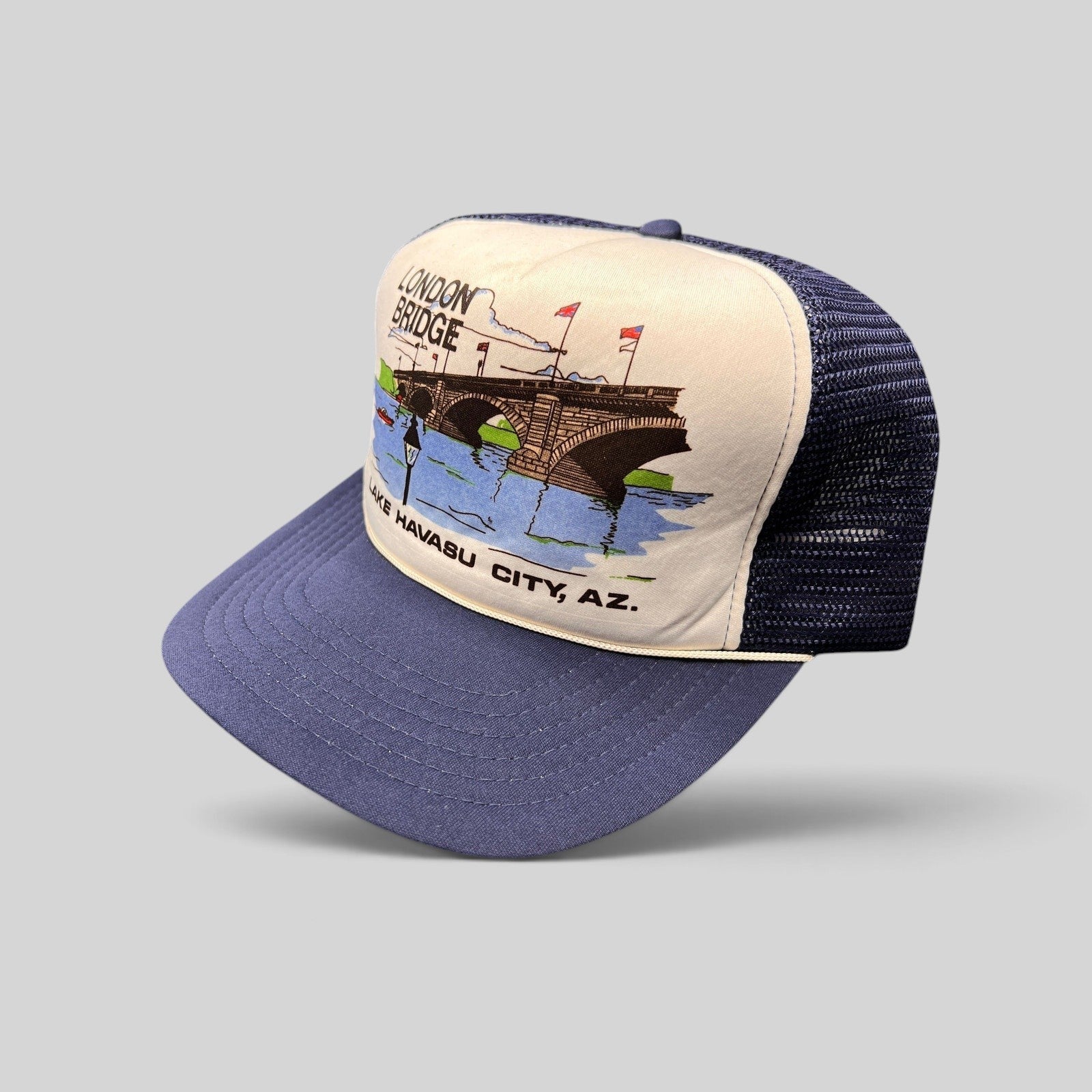 Raree Finds vintage 80s navy and white foam trucker hat featuring a London Bridge Lake Havasu City graphic print