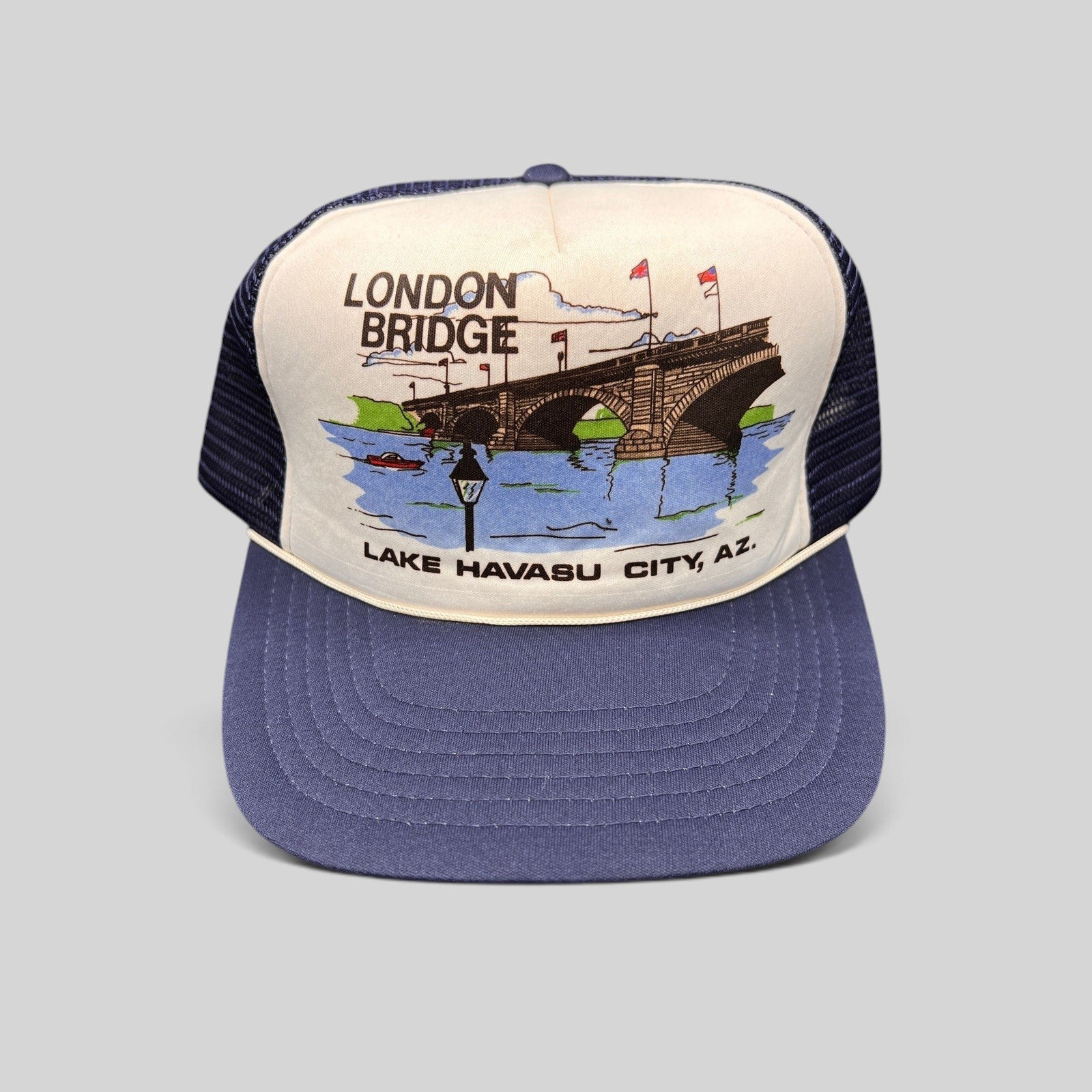 Raree Finds vintage 80s navy and white foam trucker hat featuring a London Bridge Lake Havasu City graphic print