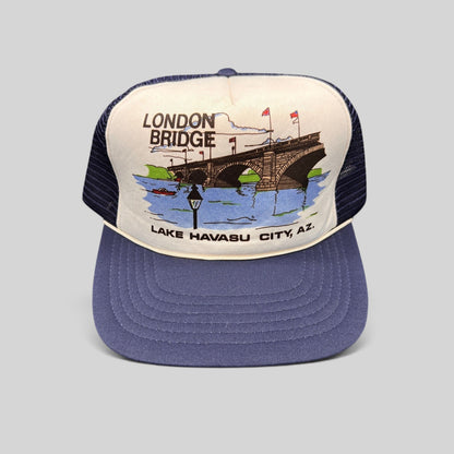 Raree Finds vintage 80s navy and white foam trucker hat featuring a London Bridge Lake Havasu City graphic print