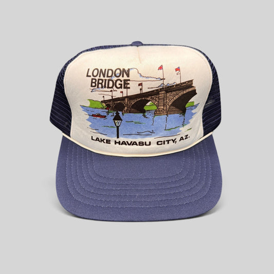 Raree Finds vintage 80s navy and white foam trucker hat featuring a London Bridge Lake Havasu City graphic print