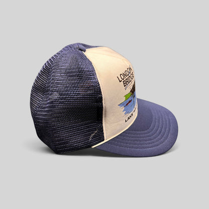 Raree Finds vintage 80s navy and white foam trucker hat featuring a London Bridge Lake Havasu City graphic print