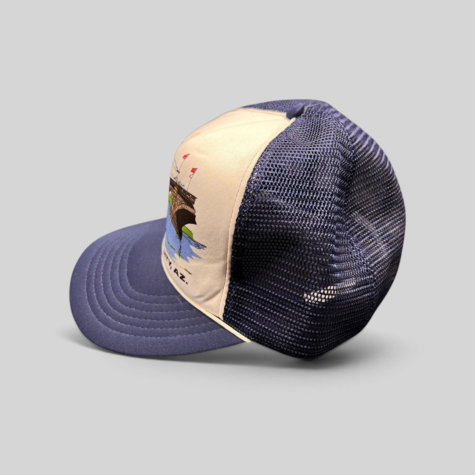 Raree Finds vintage 80s navy and white foam trucker hat featuring a London Bridge Lake Havasu City graphic print
