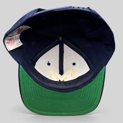 Raree Finds vintage Michigan Wolverines snapback hat interior showing green undervisor and collegiate tag