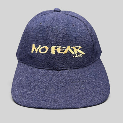 Raree Finds vintage 90s navy wool-blend snapback hat with gold No Fear Gear embroidery and structured six-panel design.