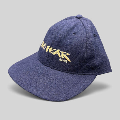 Raree Finds vintage 90s navy wool-blend snapback hat with gold No Fear Gear embroidery and structured six-panel design.