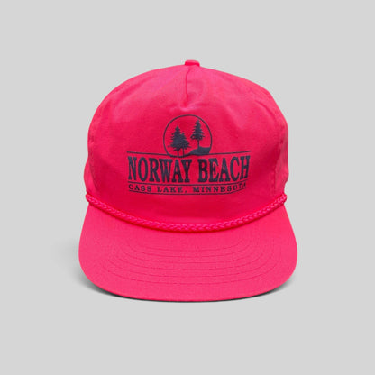 Raree Finds vintage 1980s neon pink snapback hat with navy Norway Beach graphic and decorative front braided rope.