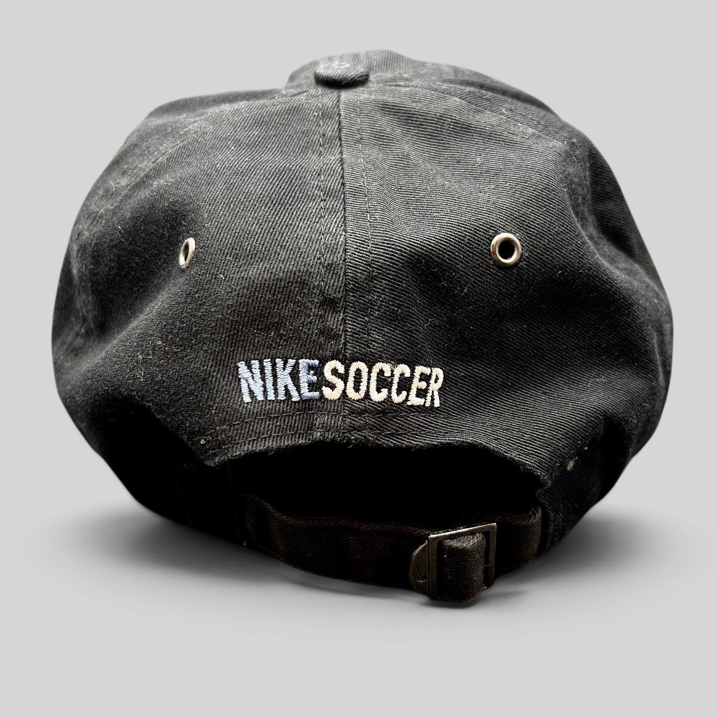 Raree Finds vintage black Nike Soccer strapback hat with embroidered logo and adjustable metal buckle back closure.