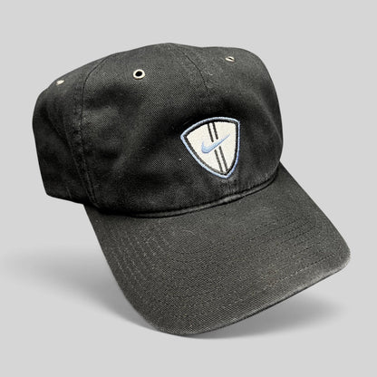 Raree Finds vintage black cotton Nike soccer strapback hat with an embroidered shield crest and blue swoosh logo.