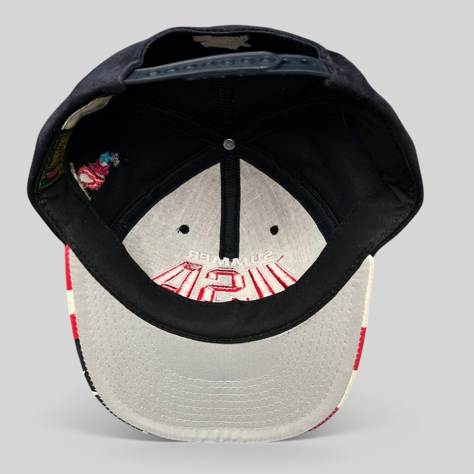 Raree Finds vintage 1996 Atlanta Olympics Starter snapback hat interior view showing structured crown and snap closure