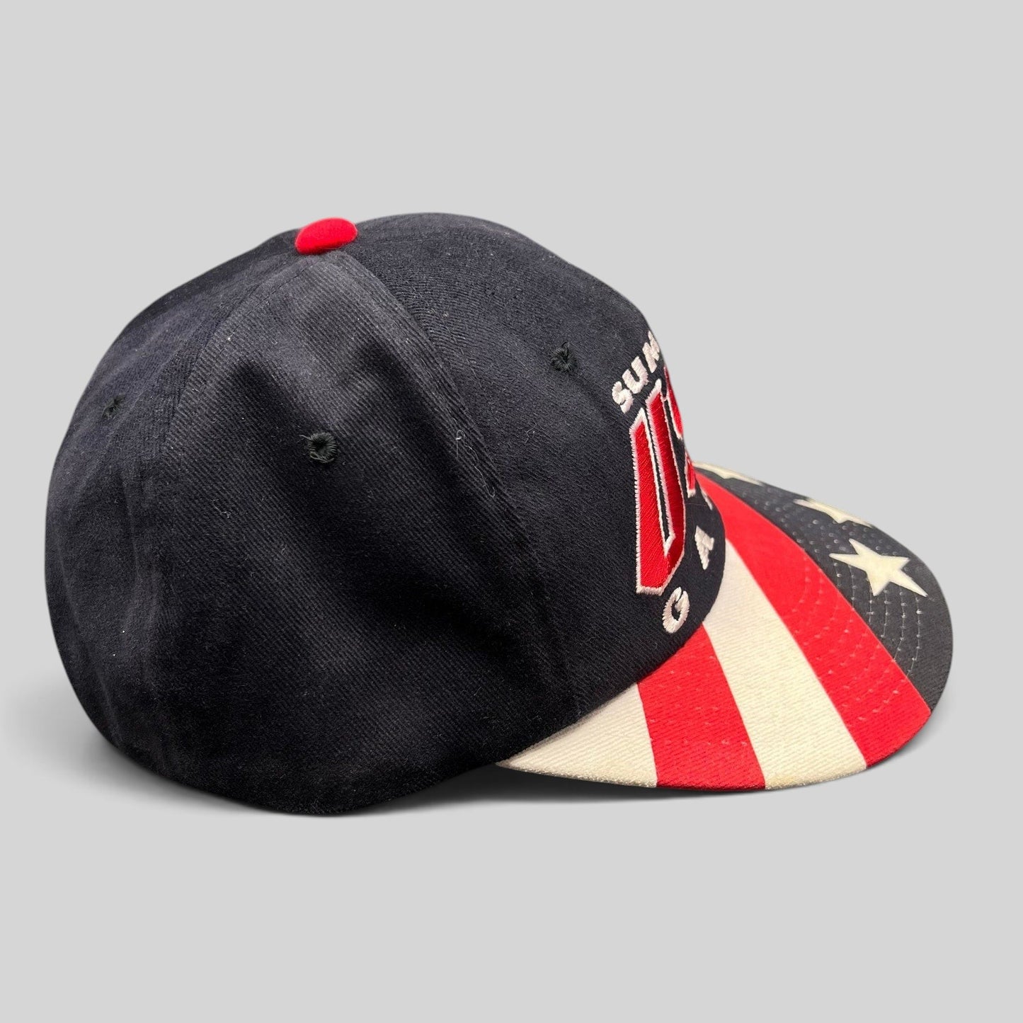 Raree Finds vintage 1996 Atlanta Olympics Starter snapback hat with black crown and American flag print brim.