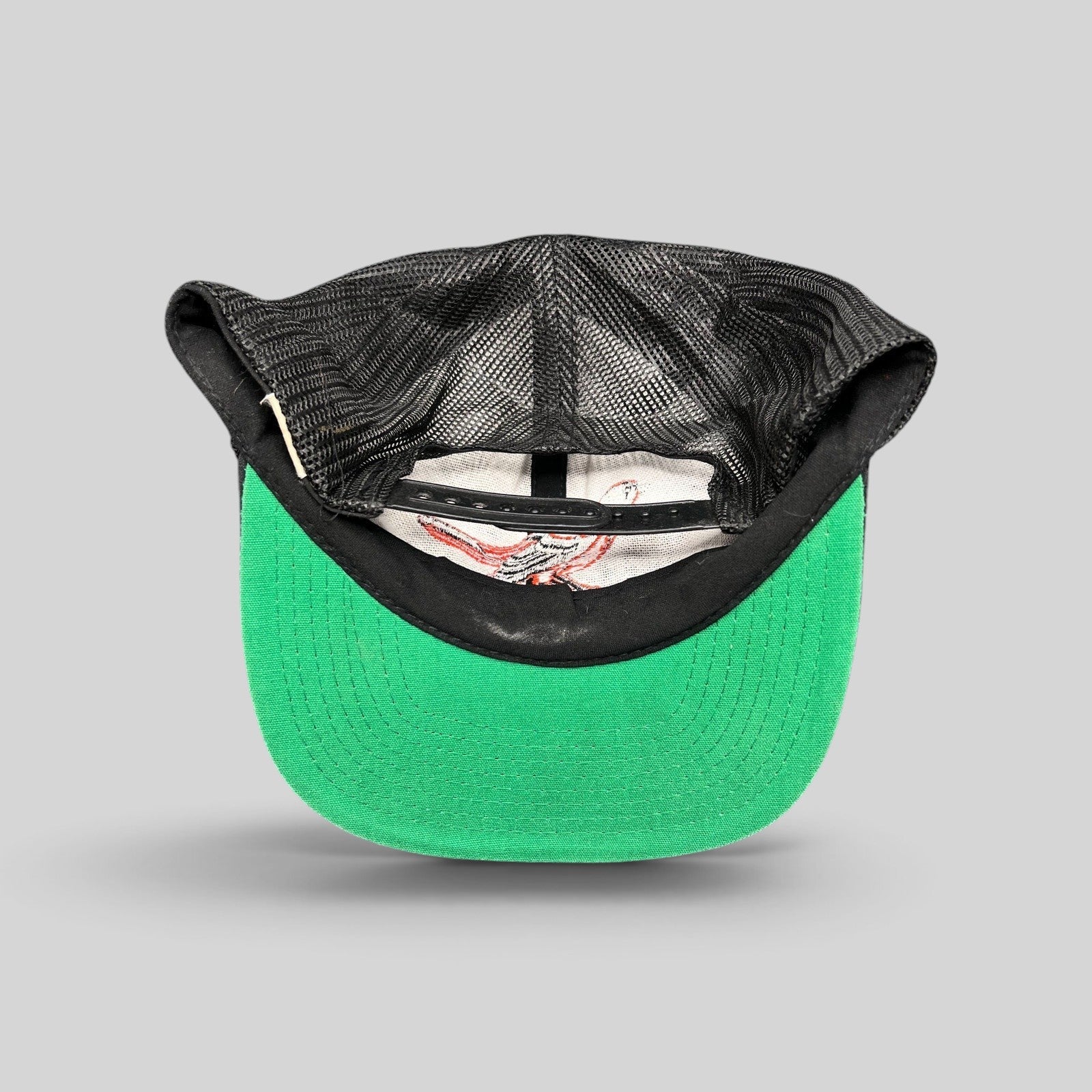 Raree Finds vintage 1980s Baltimore Orioles snapback hat showing the black mesh back and green underbrim