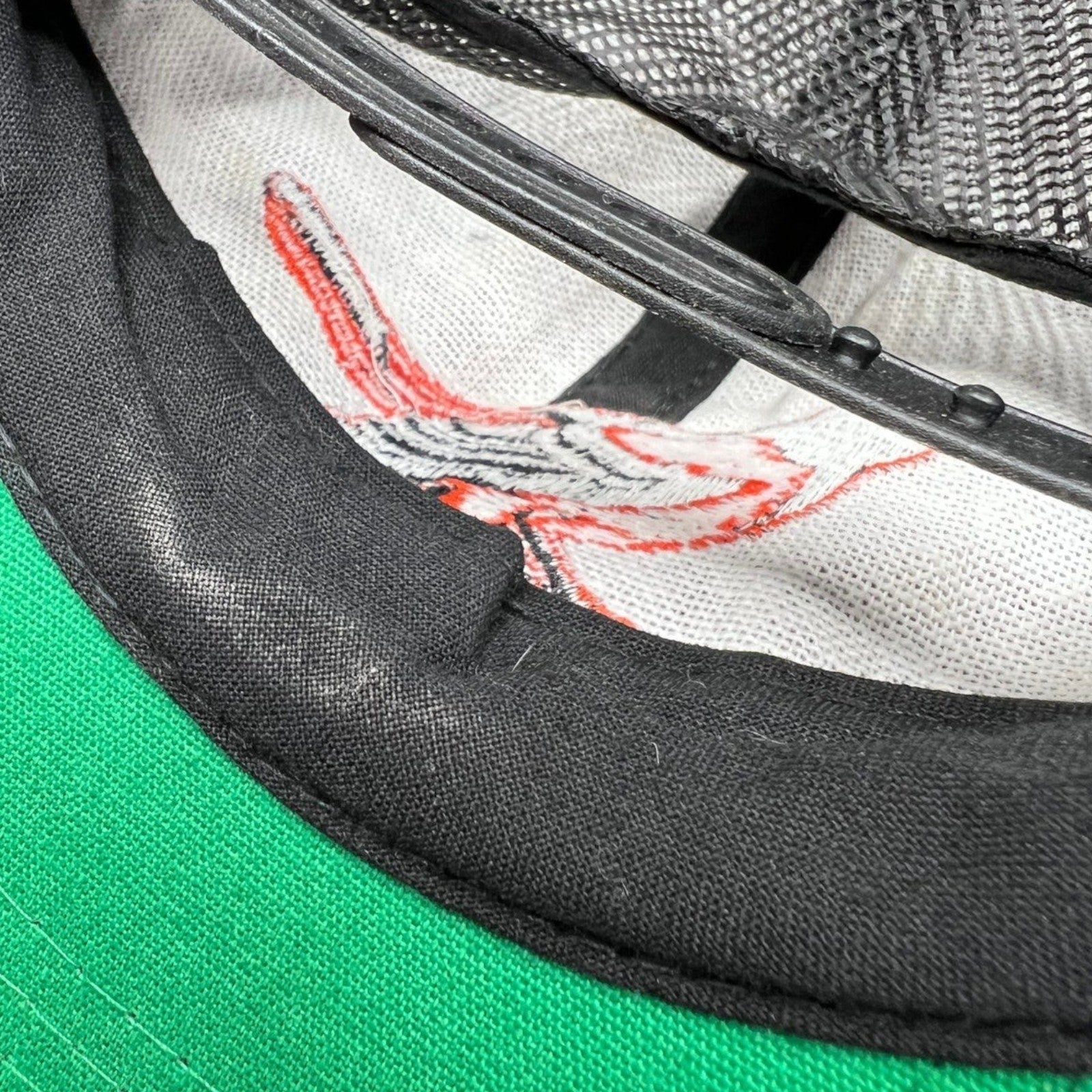 Raree Finds vintage 1980s Baltimore Orioles snapback hat interior showing the green underbrim and black mesh back