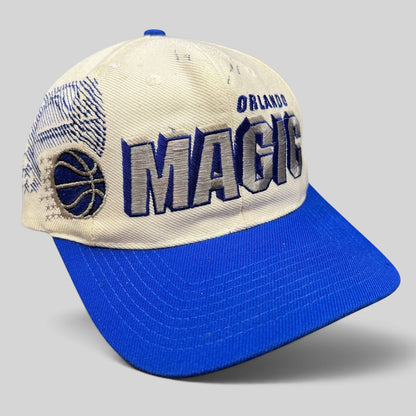 Raree Finds vintage Sports Specialties Orlando Magic snapback hat with white crown, royal blue brim, and shadow logo.