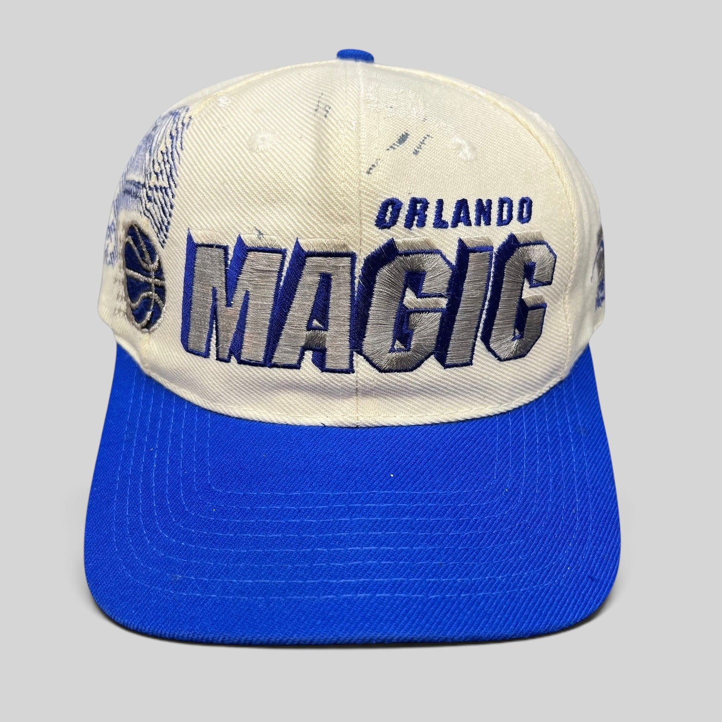 Raree Finds vintage 90s Sports Specialties Orlando Magic shadow snapback hat with white crown and royal blue brim