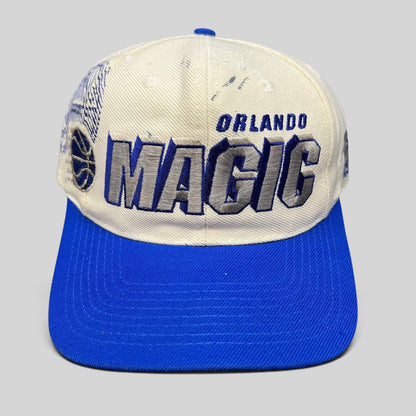 Raree Finds vintage 90s Sports Specialties Orlando Magic shadow snapback hat with white crown and royal blue brim