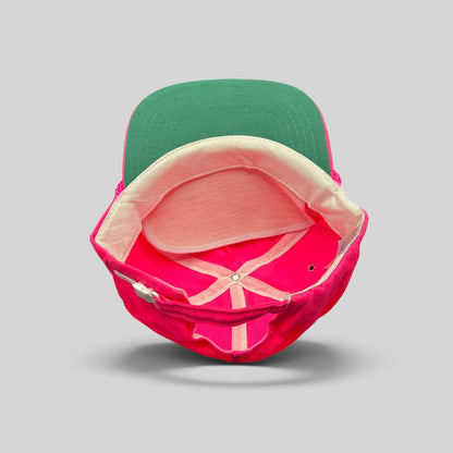 Raree Finds vintage 1980s neon pink zipperback hat with a green undervisor and interior structure detail