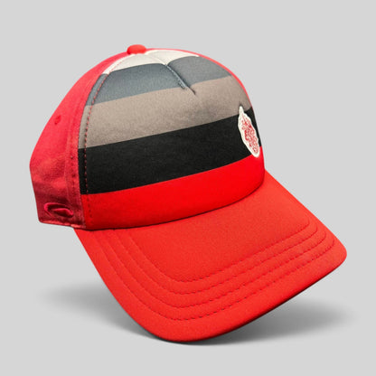 Raree Finds vintage Pukka Headwear Trump National Golf Club strapback hat in red with black and gray striped front.