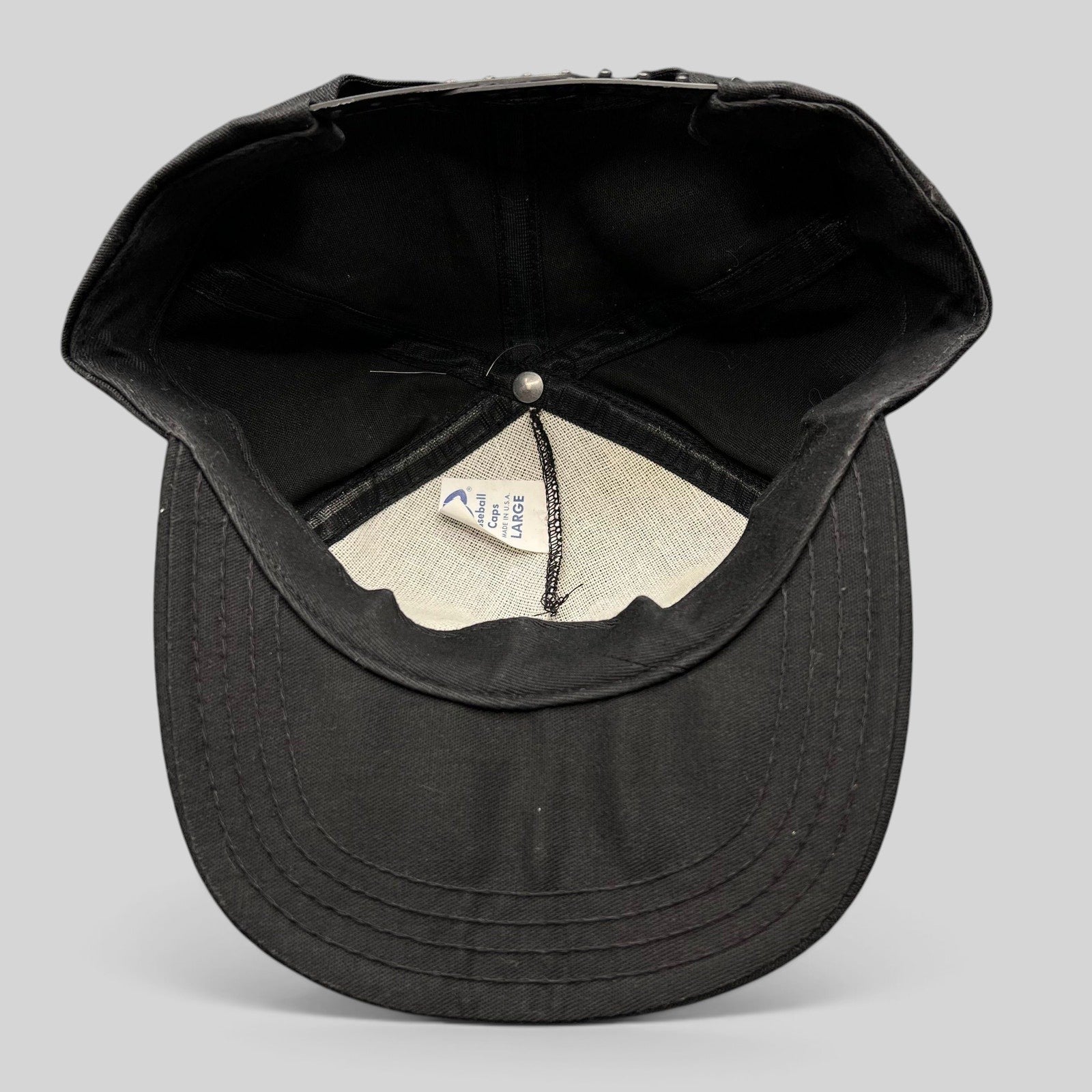 Interior view of a vintage Raree Finds Jack Daniel’s snapback hat showing the AJD Baseball Caps label and construction