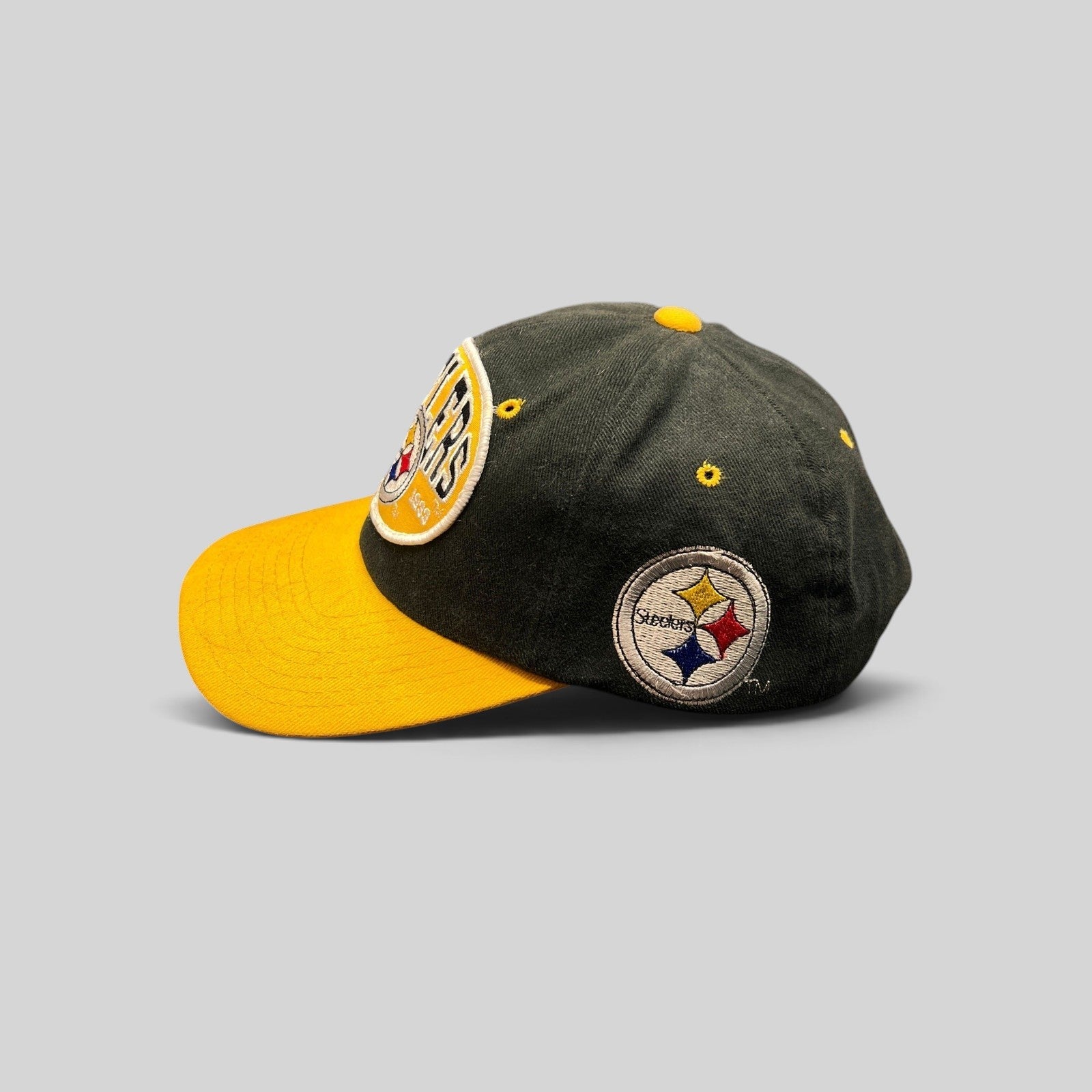 Raree Finds vintage 1990s Pittsburgh Steelers snapback hat in black and gold with embroidered team logo patches.