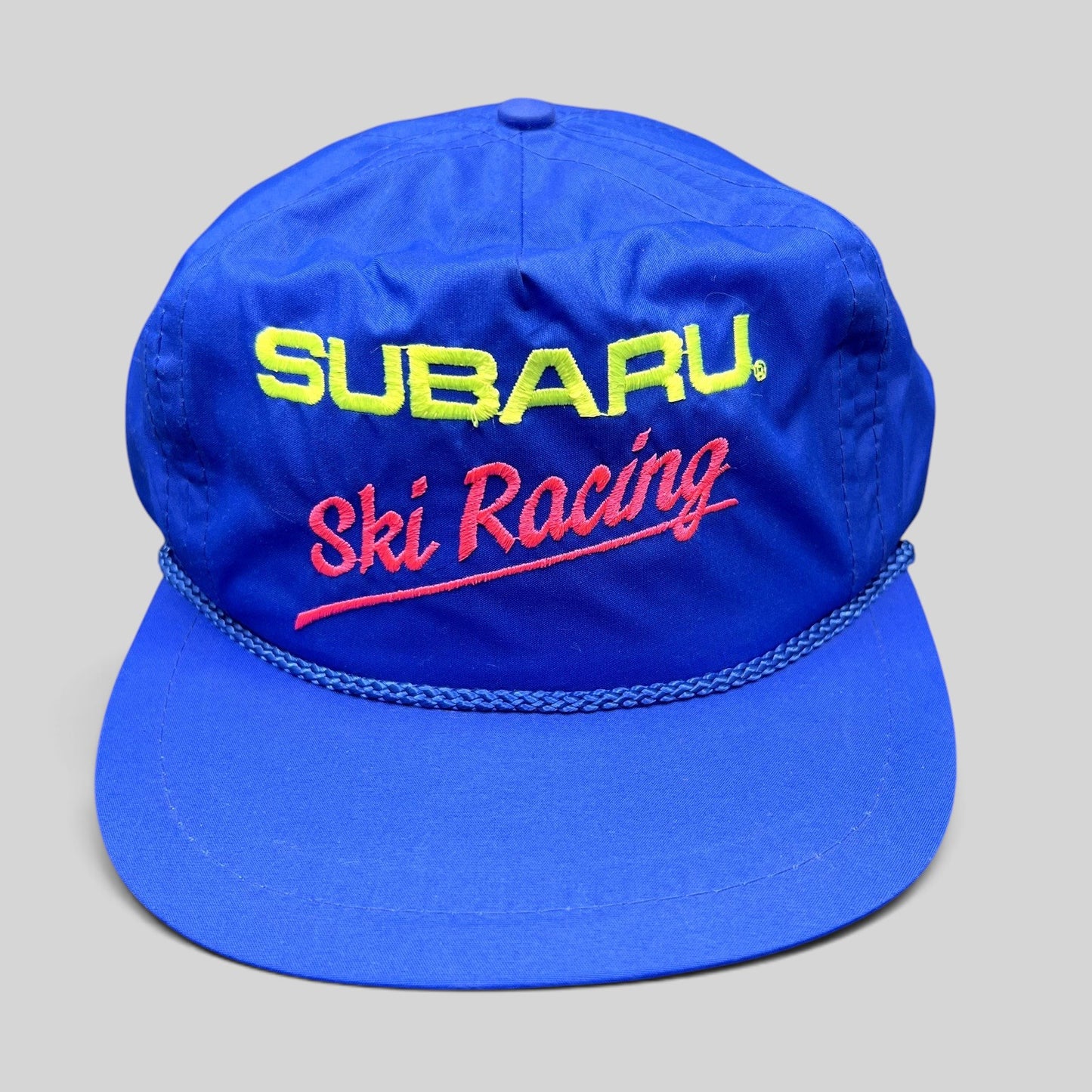 Raree Finds vintage blue nylon Subaru Ski Racing strapback hat with neon embroidery and front rope detail