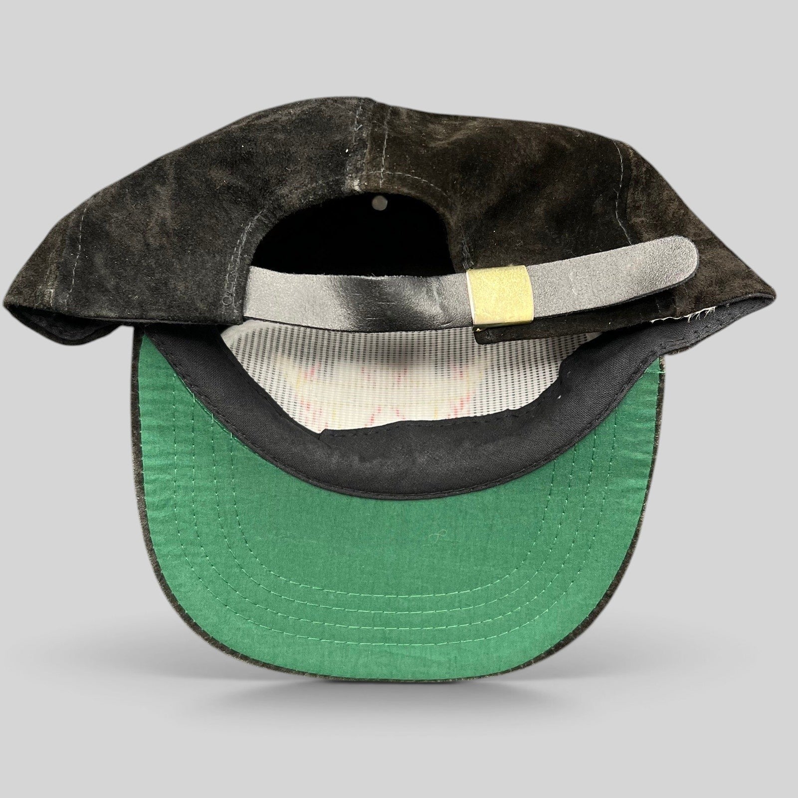 Raree Finds vintage black suede strapback hat by Ski Country Imports showing the green underside of the brim