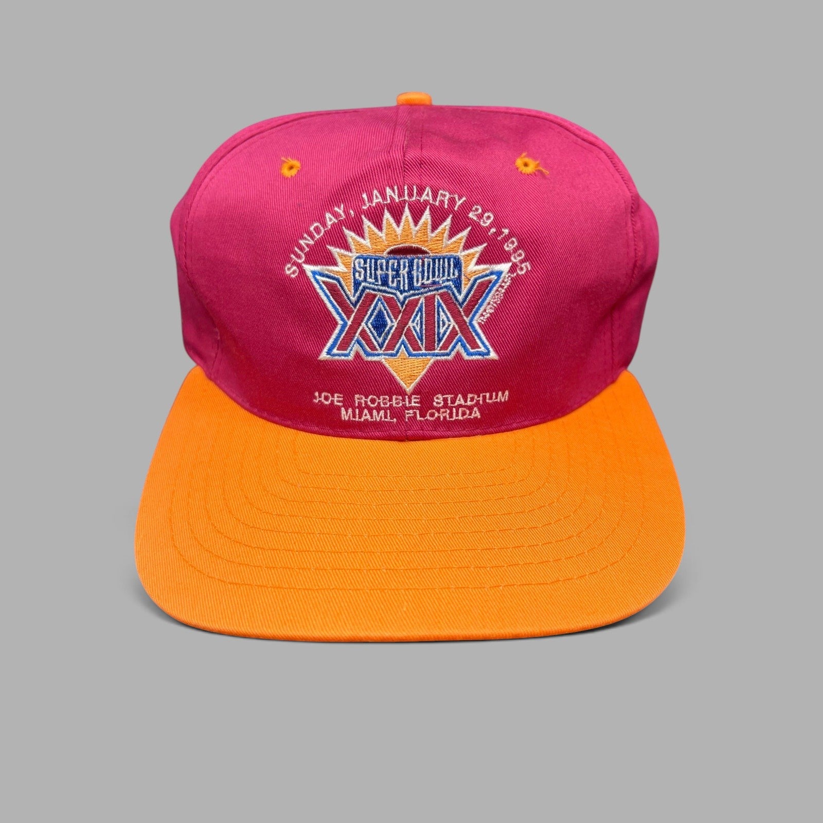 Raree Finds vintage 1995 Super Bowl XXIX New Era snapback hat with maroon crown, orange brim, and embroidered logo.