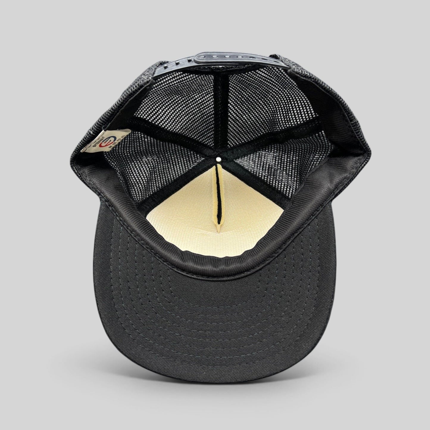 Raree Finds vintage 1989 The Who tour trucker hat interior view showing black mesh and foam lining with snapback strap