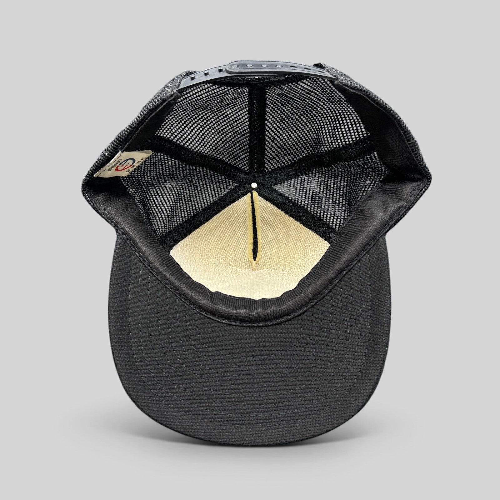 Raree Finds vintage 1989 The Who tour trucker hat interior view showing black mesh and foam lining with snapback strap