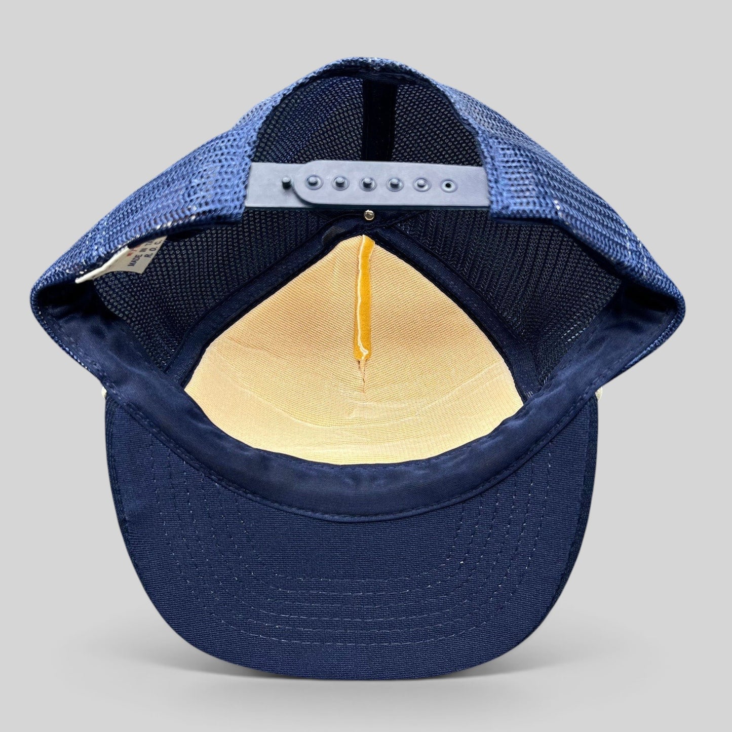 Raree Finds vintage Beverly Hills Gun Club trucker hat interior showing navy mesh back, snapback, and foam crown.