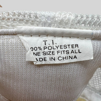Raree Finds vintage trucker hat interior tag showing 100 percent polyester material and made in China label
