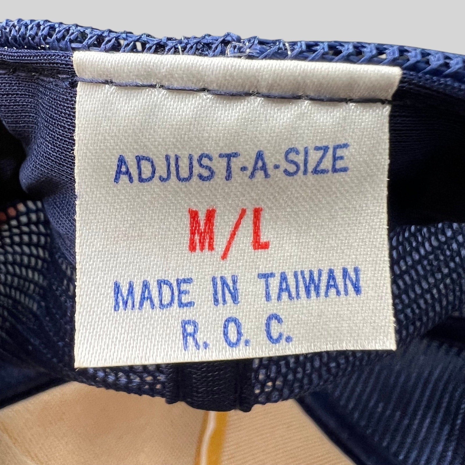 Raree Finds vintage trucker hat interior tag showing size M/L and Made in Taiwan R.O.C. production details