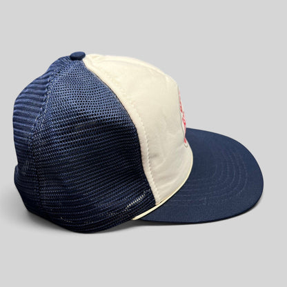 Raree Finds vintage Beverly Hills Gun Club trucker hat with white foam front, navy mesh back, and navy brim.