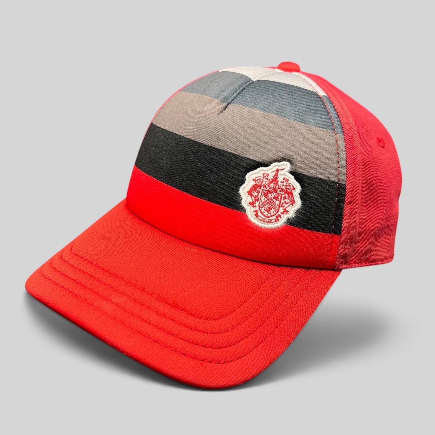 Raree Finds vintage Pukka Headwear Trump National Golf Club strapback hat in red with black and gray striped front.