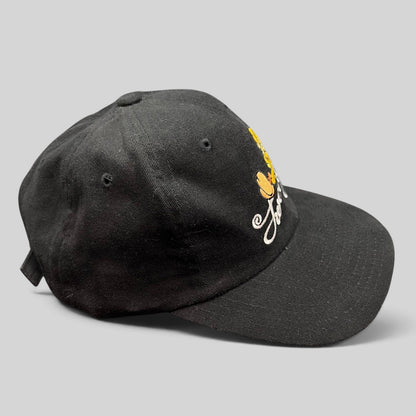 Raree Finds vintage 1998 black cotton strapback hat featuring embroidered Tweety Bird and scripted logo